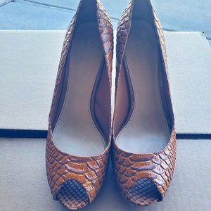 Gently used snakeskin print heels by Nine West
